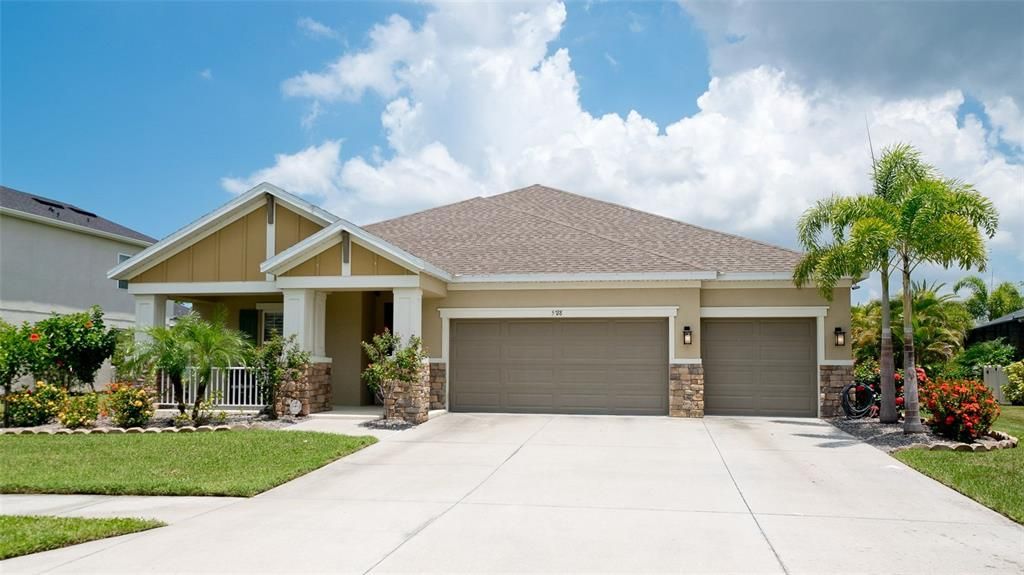 Picturesque home front porch 3 car garage