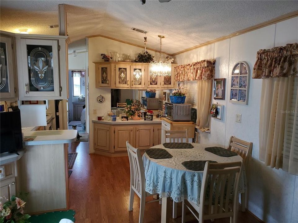 DINING AREA OFF OF THE KITCHEN WITH BUILT CABINETRY