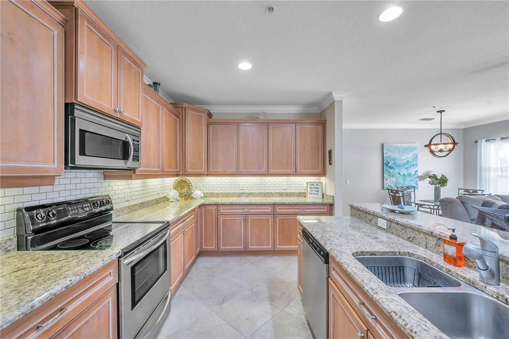 Kitchen with Stainless Steel appliances, granite counters and wood cablinets