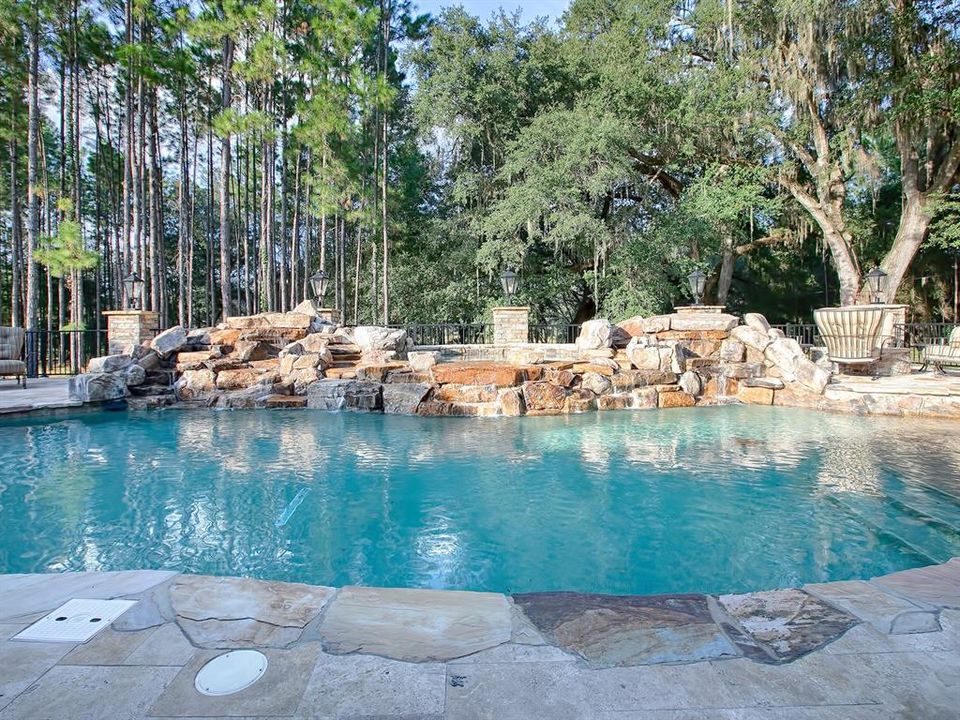 SIMPLY BREATHTAKING! THIS CUSTOM DESIGNED SALTWATER POOL & SPA IS GAS-HEATED AND HAS A WATERFALL FEATURE!!!