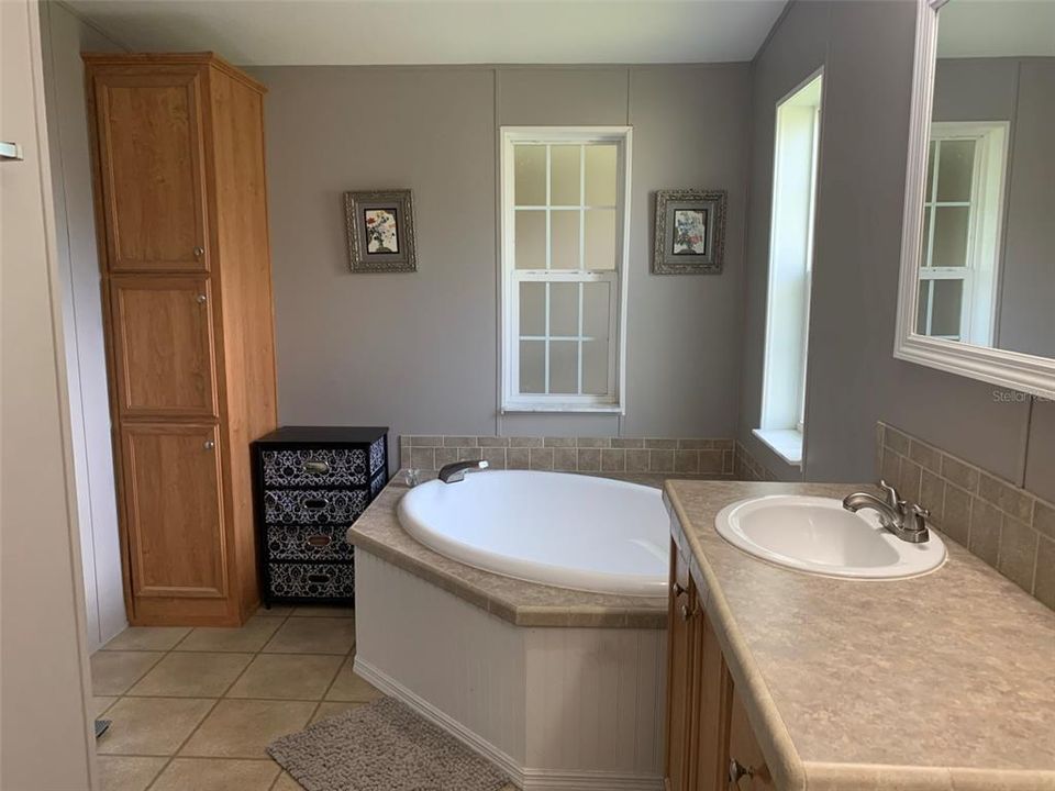 Master bathroom garden tub, built in cabinet