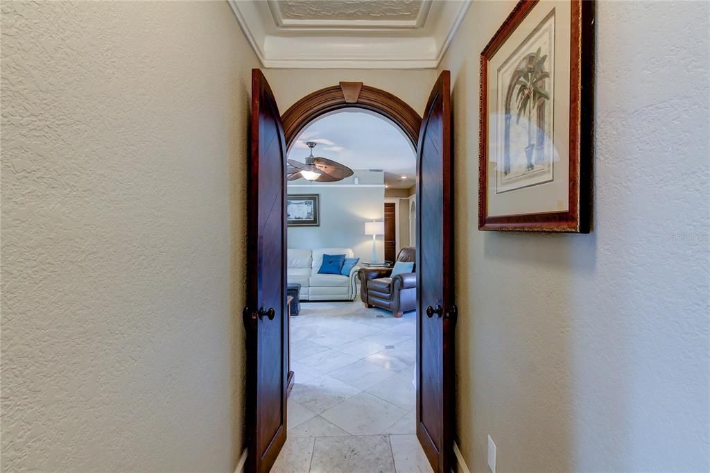 ARCHED ENTRY DOORS TO UPSTAIRS FAMILY ROOM