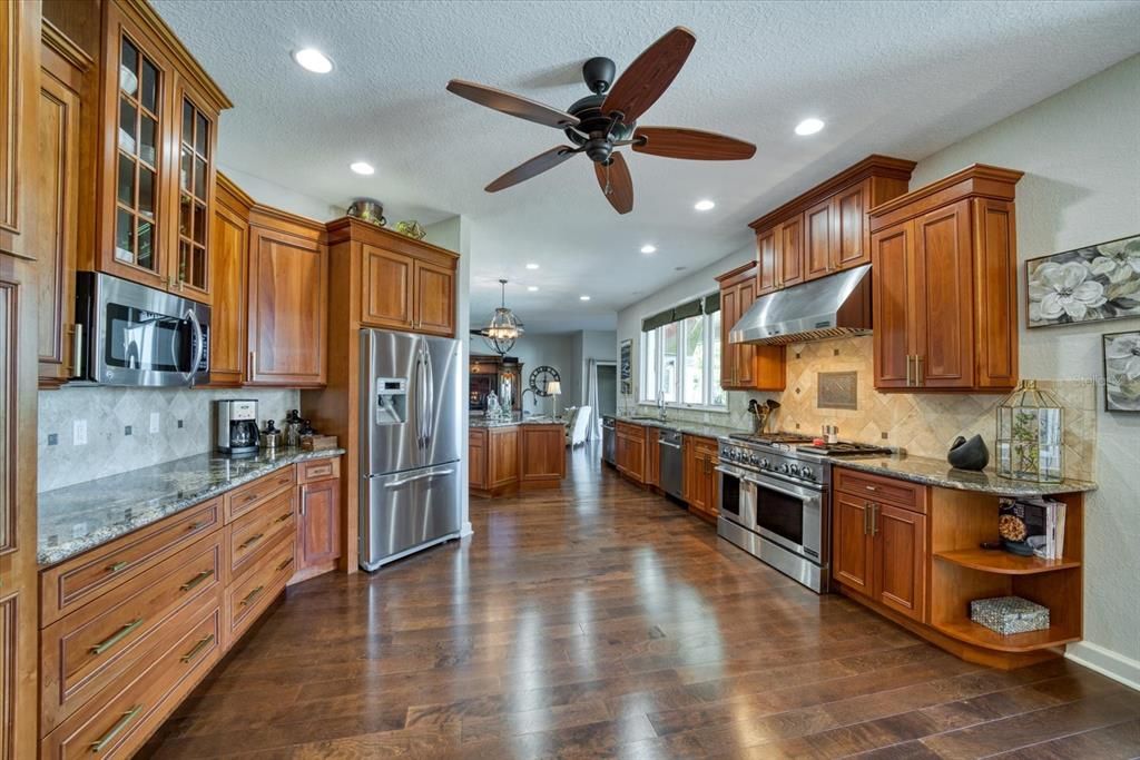 A culinary experience, the kitchen is a chef's dream.Granite counters, top of the line appliances, 2 dishwashers, 6 burner gas stove, abundant storage in custom cabinets.
