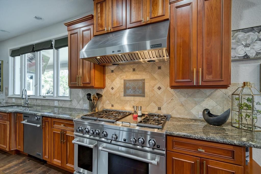 Stainless appliances complement attractive custom cabinetry.