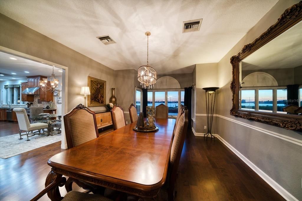 Dining room adjoins the spacious kitchen area and has vast views of the private yard to the intracoastal waterway.