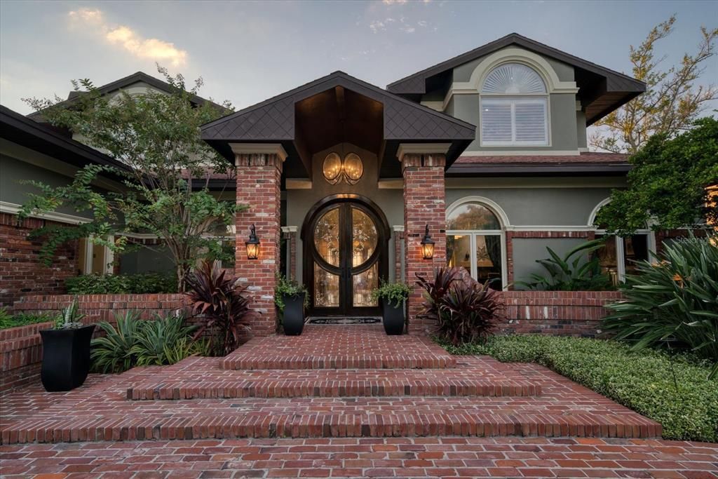 Welcome! Custom doors with exquisite inlaid leaded glass only hint at the interior of this outstanding residence.