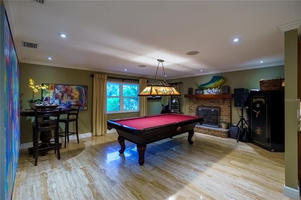 Look at this game room with the fire place