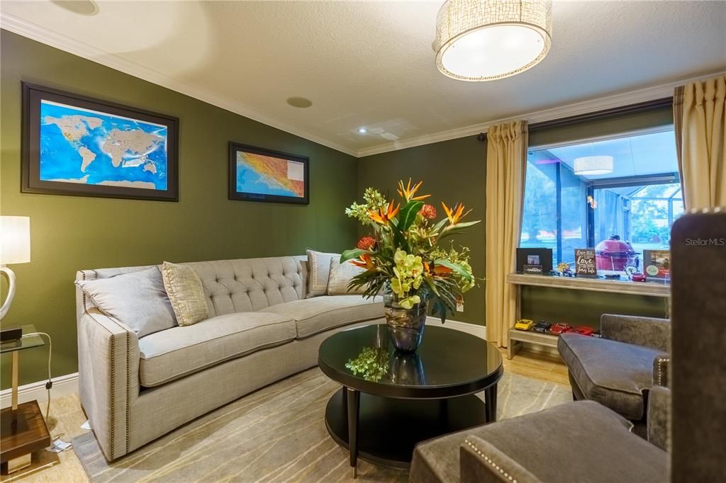 Have a great family time in this living area overlooking the pool area