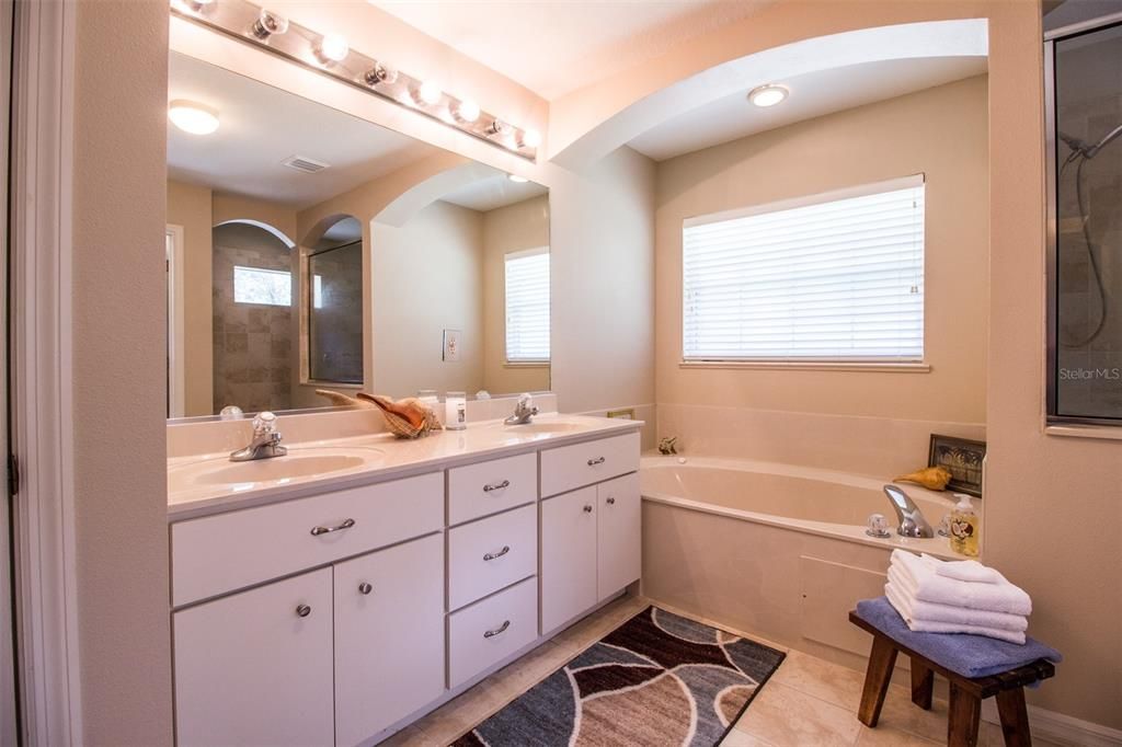 Double sink vanity and jetted tub.