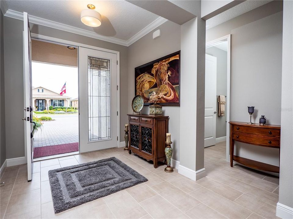 FRENCH DOORS WITH LEADED GLASS. ENTRANCE FOYER.