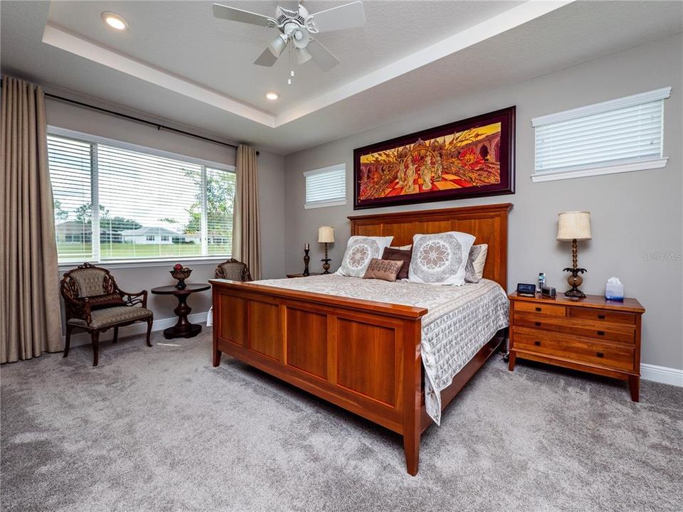 MASTER SUITE WITH GOLF COURSE VIEW.