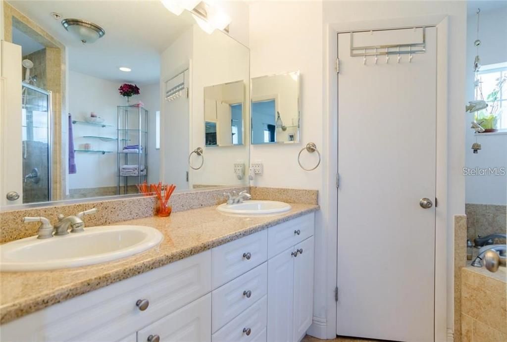 Primary Bath dual vanities, walk in shower and private water closet.