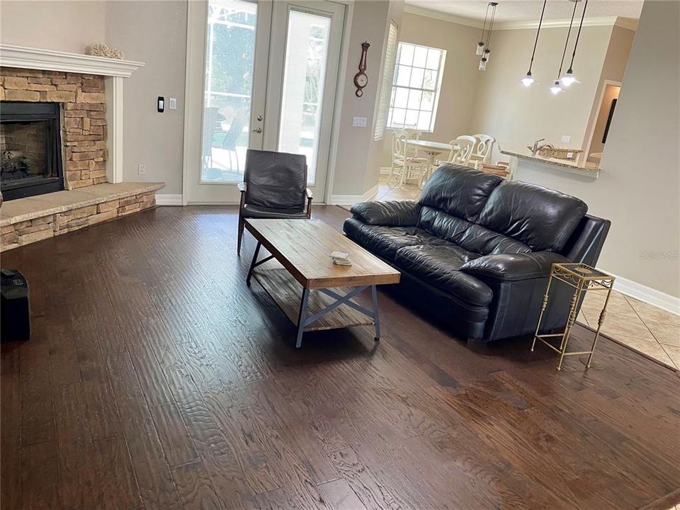 wood flooring & gas fireplace in living room