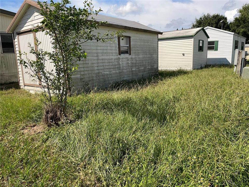 View of full sized shed that stays with the home