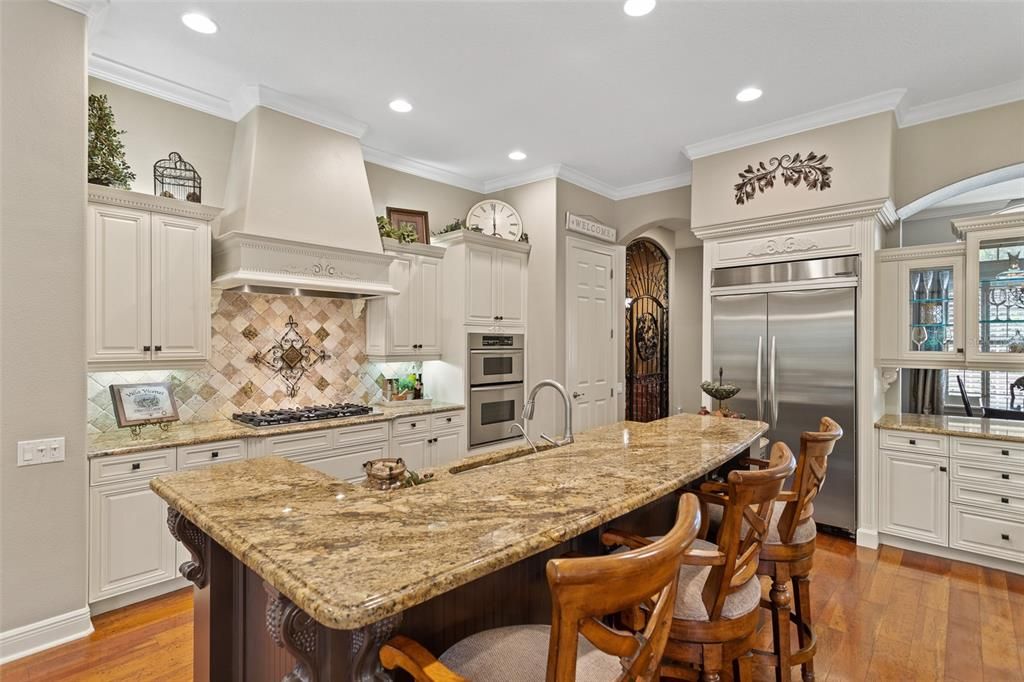 Kitchen Island is hub of the kitchen surrounded by gourmet appliances