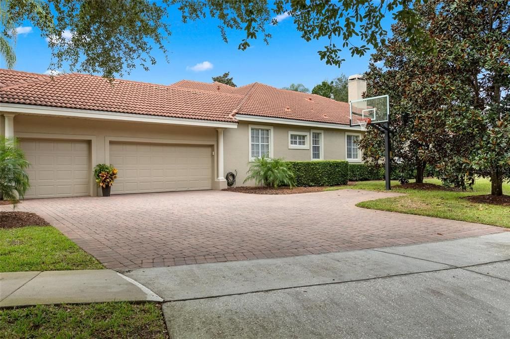 3-Car Garage has nice paver driveway