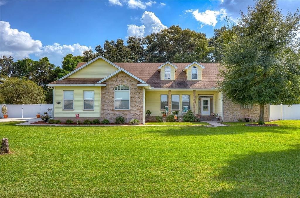 This charming home is tucked back on one acre of pure bliss!