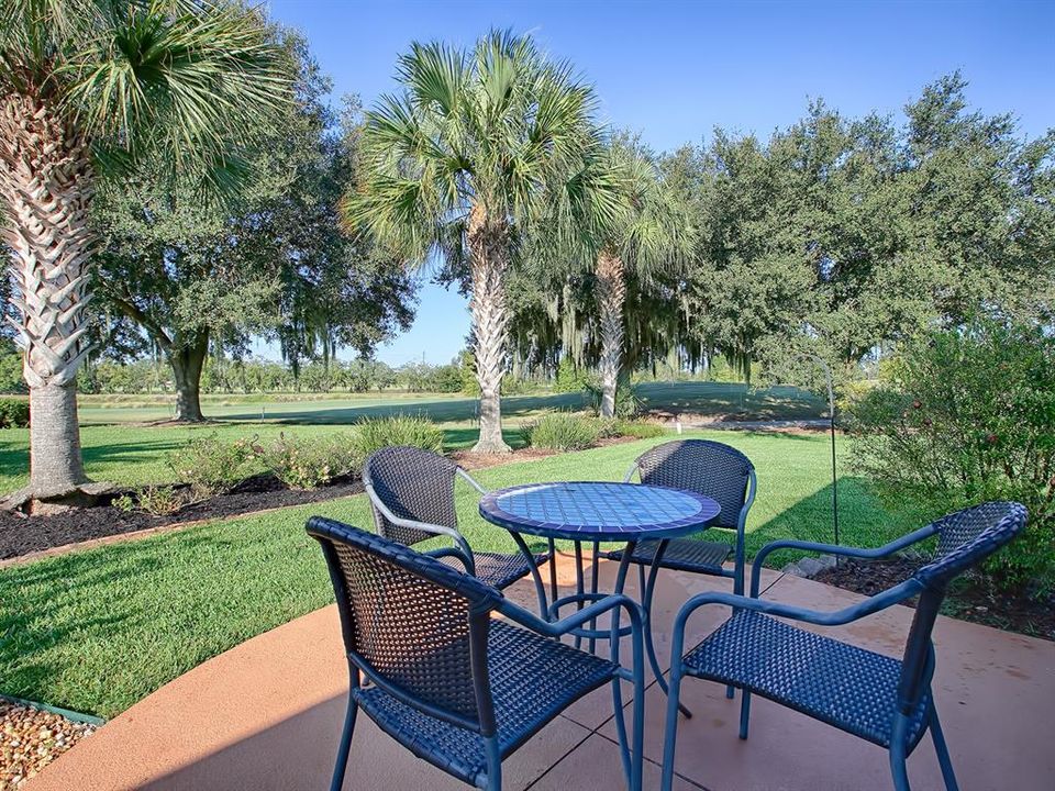 Another outdoor seating area overlooking the golf course