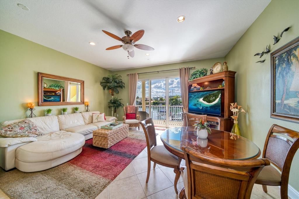 Large great room with adjoining kitchen with hurricane sliders offering amazing water views.