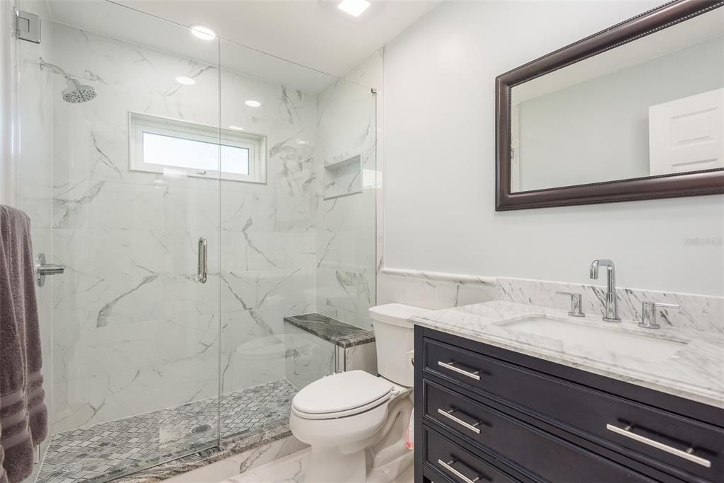 Full bathroom completely updated and conveniently between both guest bedrooms.