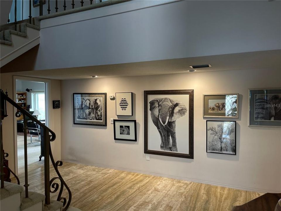 Enter into 2 story foyer boasting plentiful space for photos or artwork