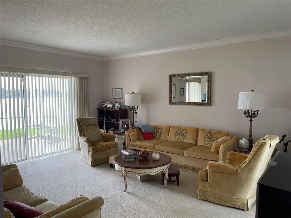 Living room on main level affords waterview