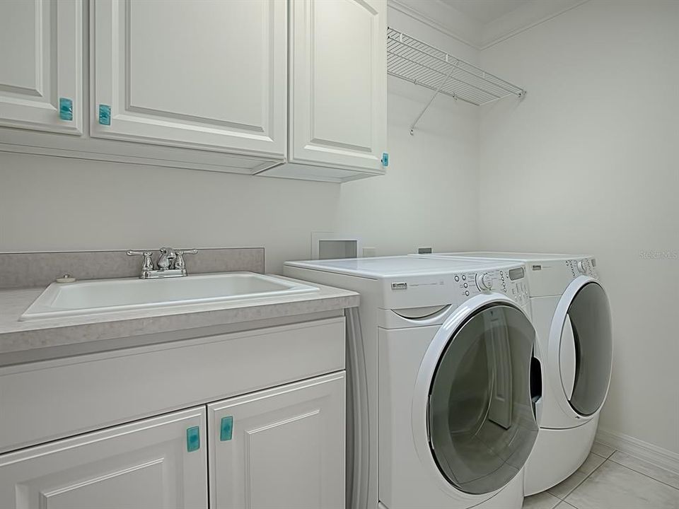 LAUNDRY ROOM, SINK, CABINETS, AND A LARGE CLOSET!