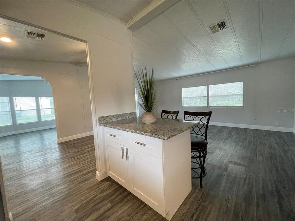 kitchen island, dining and living room