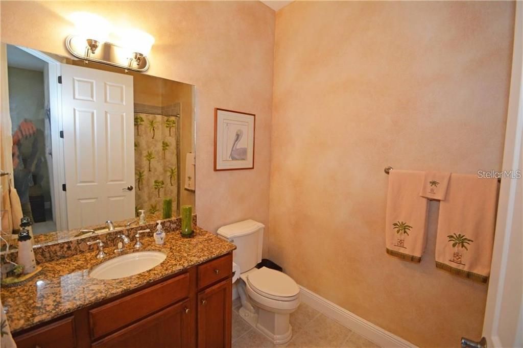 The third full bathroom is privately designed off of the fourth bedroom.