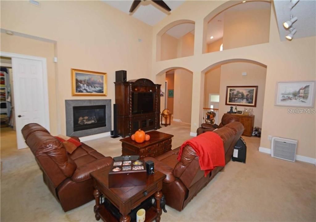 Formal living room features a fireplace.