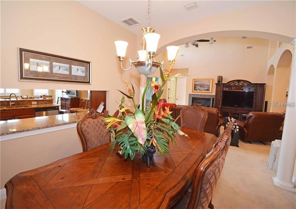 Formal dining room with pass through opening overlooking living room.