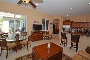 Kitchen is opened to the family room; features sliding doors stepping out to the al fresco balcony.