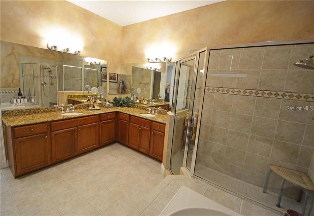 The lovely master bathroom has a large, glass enclosed, shower.