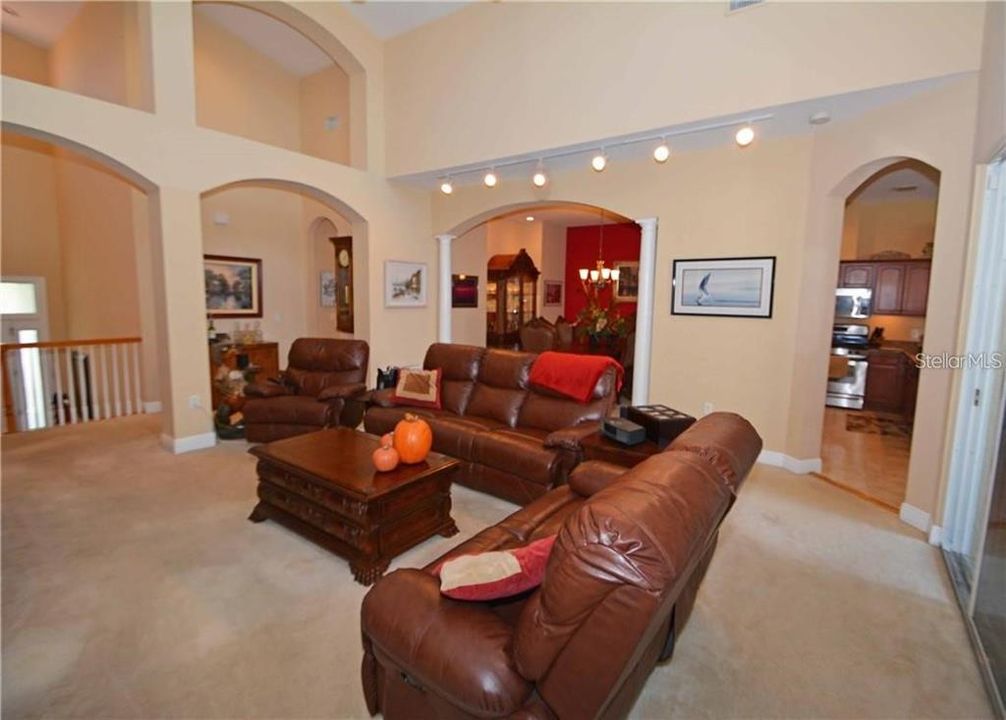 Formal living room with soaring ceilings.