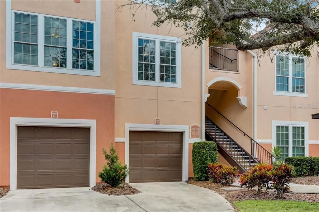30 foot deep garage on the right and condo right above