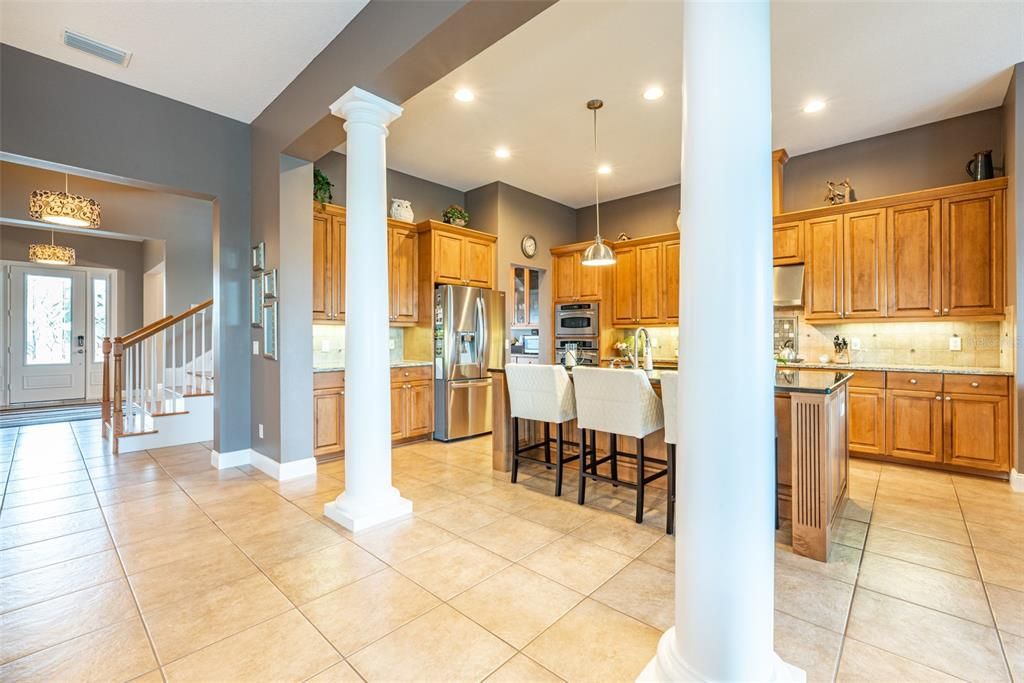 Absolutely ideal for entertaining the kitchen and family room run together.   Both lead to the screened lanai and pool.