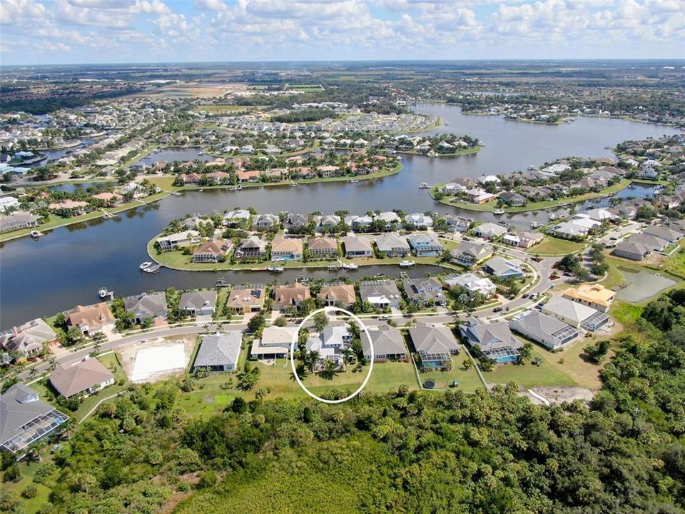 Aerial view of the Mirabay 136 acer lagoon.  Your home is located with in the circle.  Front door faces East.
