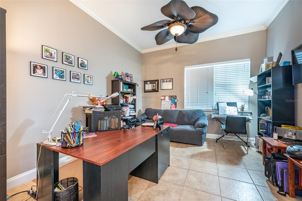 Enjoy this huge home office with tons of natural light measuring 12x14.  Plenty of room for a large desk and sitting area. Located next to front door off main foyer.