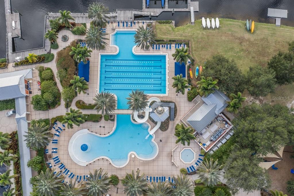 Family resort style zero entry pool with slide and play area, heated lap pool, quiet reflecting pool.