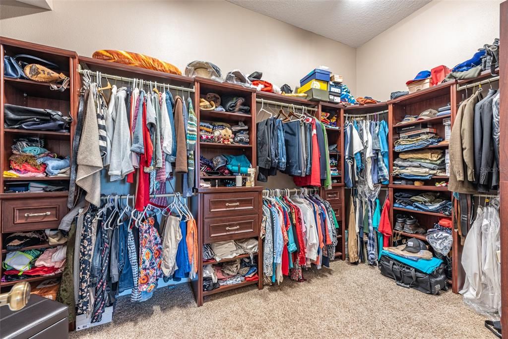 Huge shared 9x14 master bedroom closet with built ins stay with the home.
