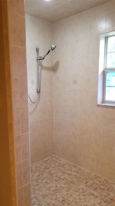 Large Shower in Her Bathroom.  His Bathroom has own vanity, toilet and shower