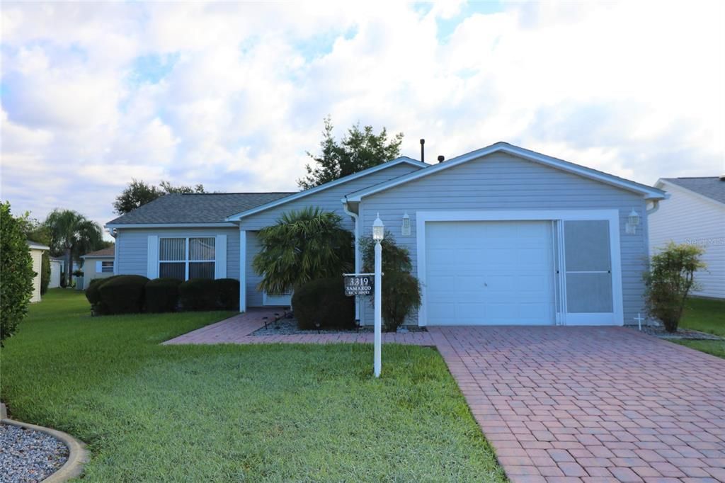 FRONT EXTERIOR, PAVERS IN DRIVE & WALKWAY, SCREENS ON GARAGE DOOR