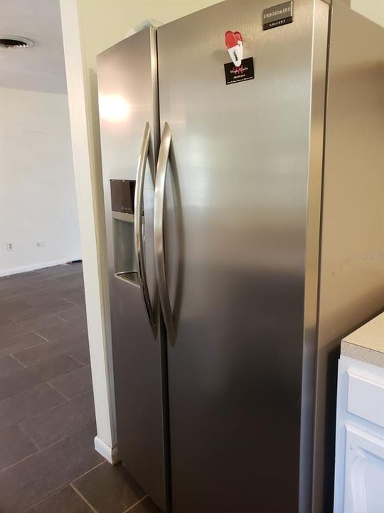 SIDE BY SIDE STAINLESS FRIGIDAIRE REFRIGERATOR, ICE AND WATER ON DOOR