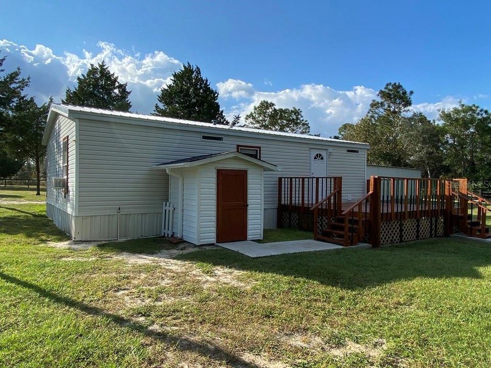 REAR SIDE HOME WITH LAUNDRY SHED AND REAR DECK