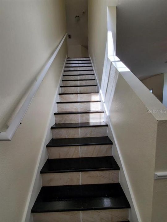stairs from family room to all bedrooms