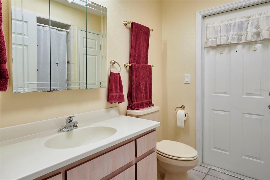 Guest bathroom that also has a door that leads out to the Florida room