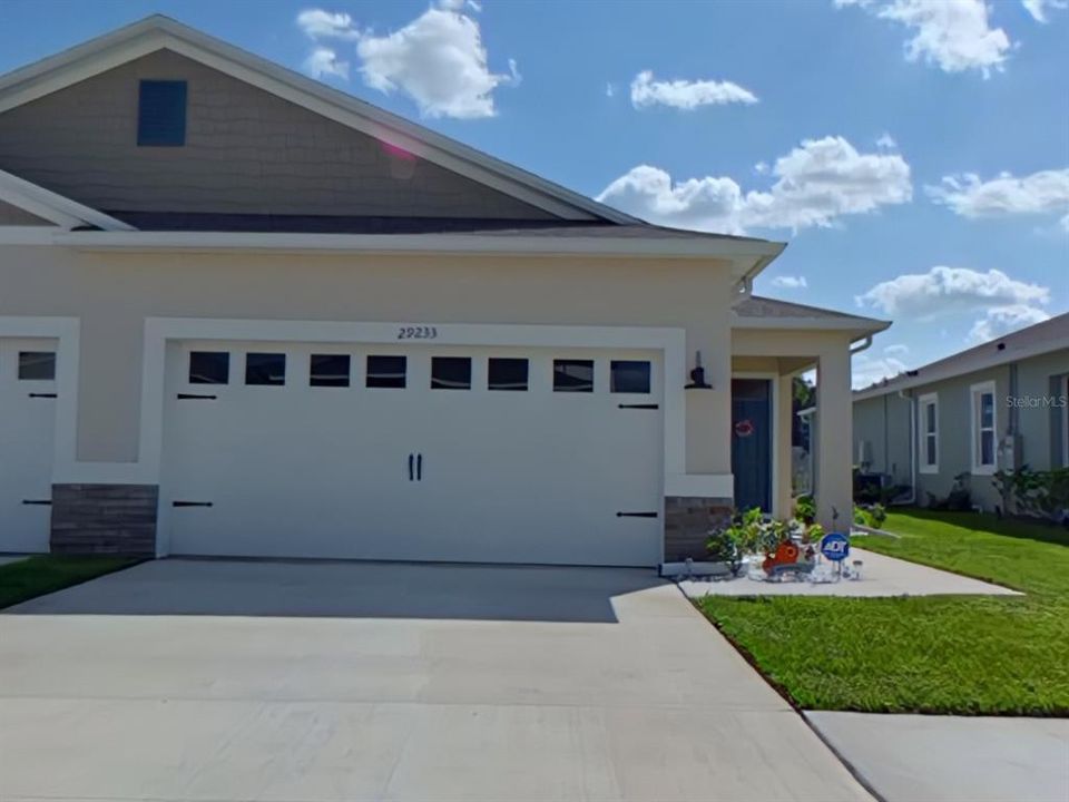 Home offers side entry front door and Coach Lighting