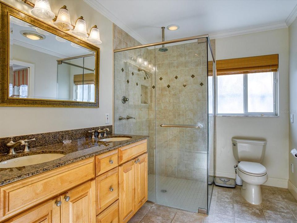 Double Sinks, Granite Counters & Large Glass Enclosure for Shower in Master Bath