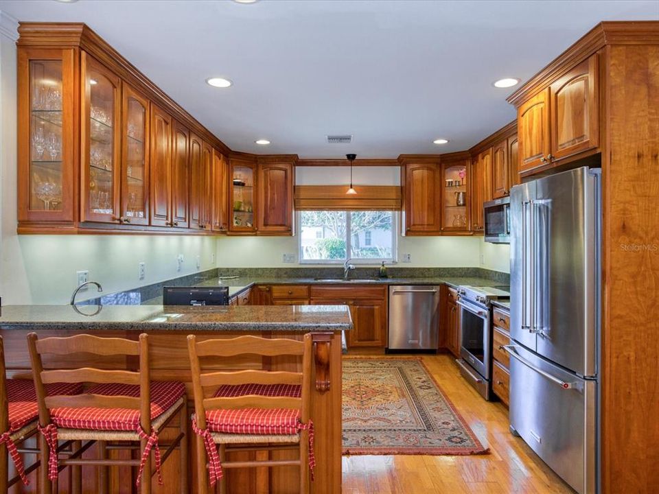 Gorgeous Kitchen with Solid Wood & Lighted Glass Cabinets, and Undermount Lighting