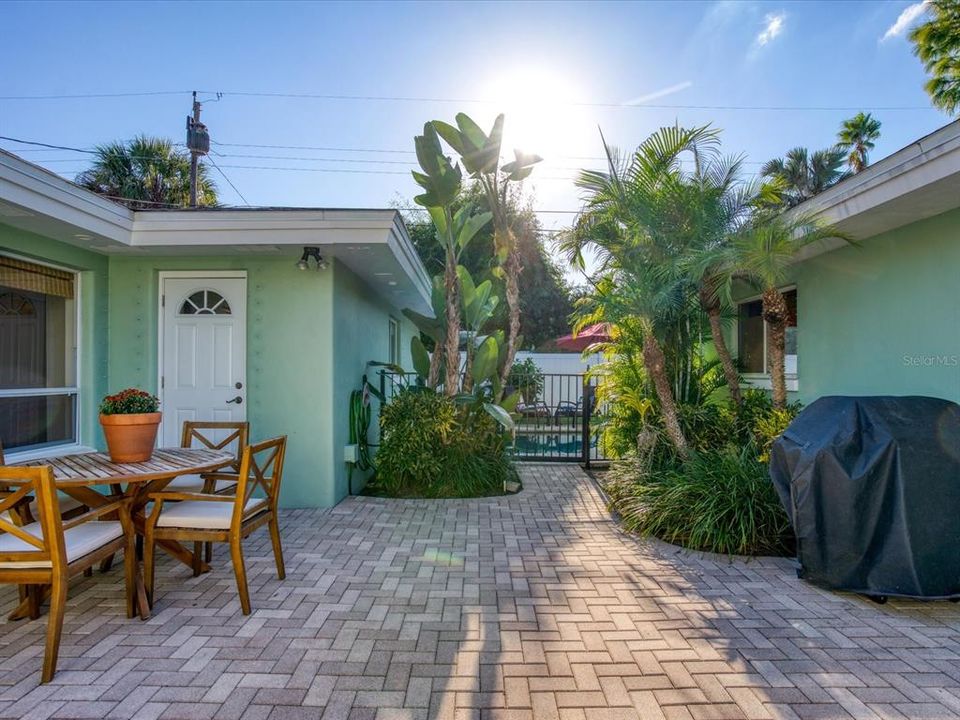 Lushly landscaped, Pavers and Outdoor Dining & Grilling in the Private Courtyard!